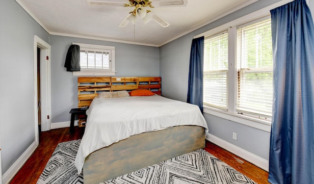 bedroom with ornamental molding, wood finished floors, baseboards, and a ceiling fan
