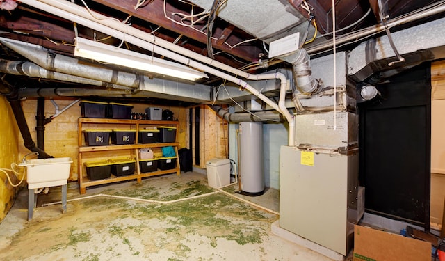 unfinished basement with gas water heater and a sink