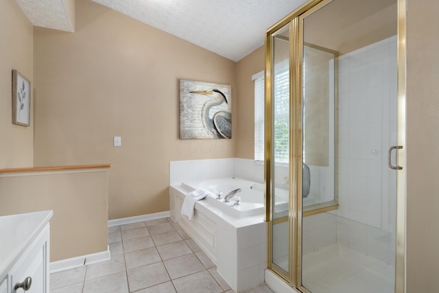 6289 Corley Dr, Dublin, OH 43016 - full bathroom with vaulted ceiling, tile patterned floors, a garden tub, a stall shower, and a textured ceiling