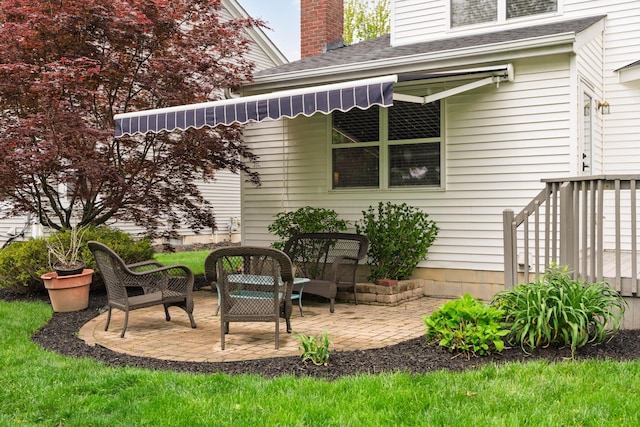 6289 Corley Dr, Dublin, OH 43016 - back of property featuring a patio area, a shingled roof, and a chimney