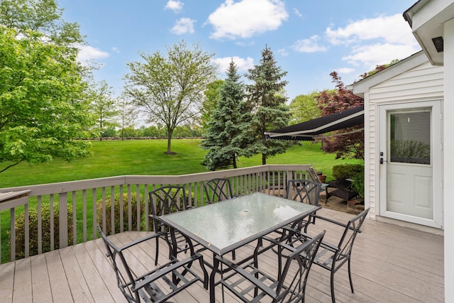 6289 Corley Dr, Dublin, OH 43016 - wooden deck with outdoor dining space and a yard