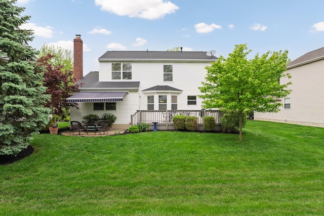 6289 Corley Dr, Dublin, OH 43016 - rear view of property featuring a chimney, a yard, a patio, and roof with shingles