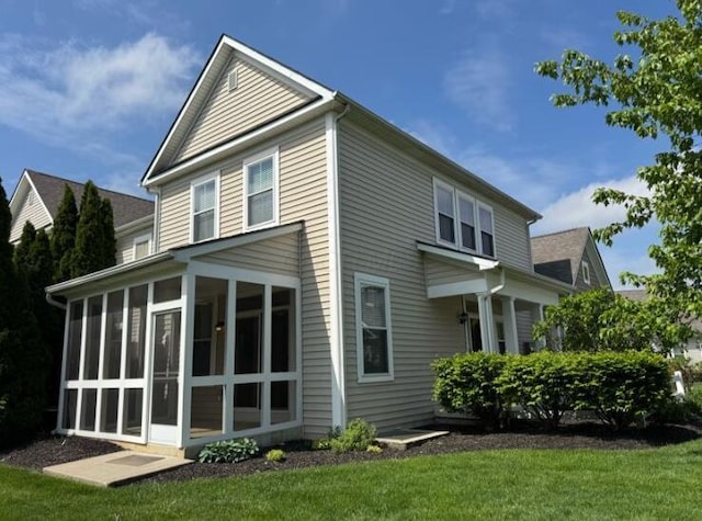 4020 Legend Unit 11, Columbus, OH 43230 - rear view of property with a sunroom and a yard