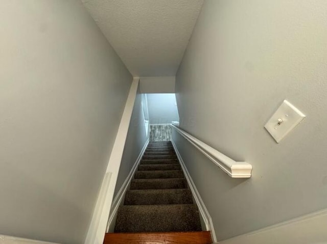4020 Legend Unit 11, Columbus, OH 43230 - stairs featuring a textured ceiling, carpet, and baseboards