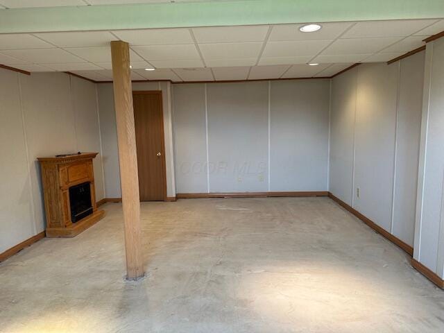 50 Stagecoach Rd, Chillicothe, OH 45601 - finished basement with a paneled ceiling, a fireplace, baseboards, and a decorative wall
