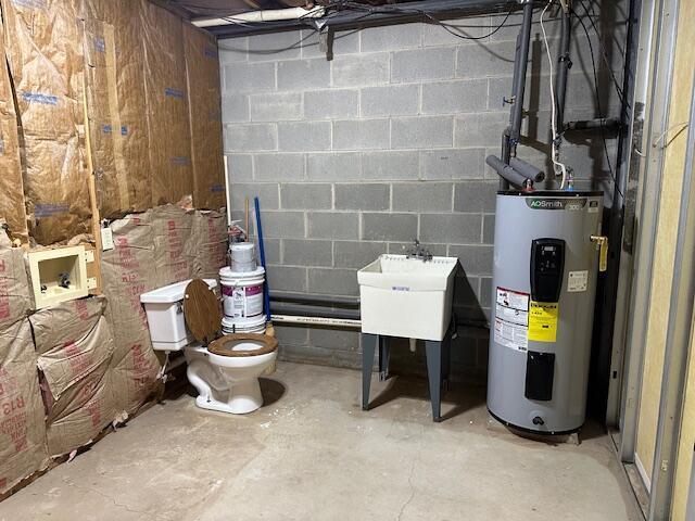 50 Stagecoach Rd, Chillicothe, OH 45601 - unfinished basement featuring water heater and concrete block wall