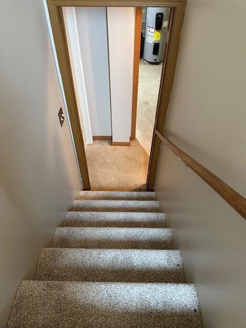 50 Stagecoach Rd, Chillicothe, OH 45601 - staircase featuring electric water heater and carpet flooring