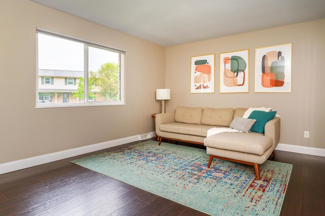 1671 Dollivor Dr, Columbus, OH 43235 - living room featuring baseboards and dark wood-type flooring