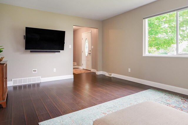 1671 Dollivor Dr, Columbus, OH 43235 - unfurnished living room featuring wood finished floors and baseboards