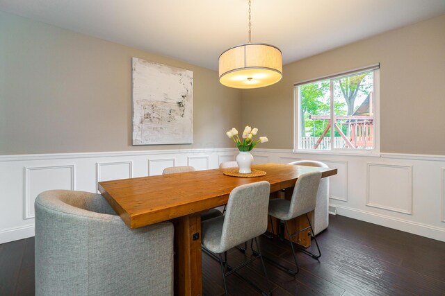 1671 Dollivor Dr, Columbus, OH 43235 - dining area with a wainscoted wall, a decorative wall, and dark wood-style flooring