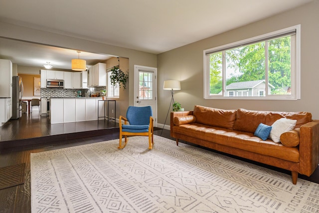 1671 Dollivor Dr, Columbus, OH 43235 - living room featuring dark wood-style floors and baseboards