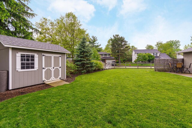 1671 Dollivor Dr, Columbus, OH 43235 - view of yard with a storage shed, an outdoor structure, and a patio