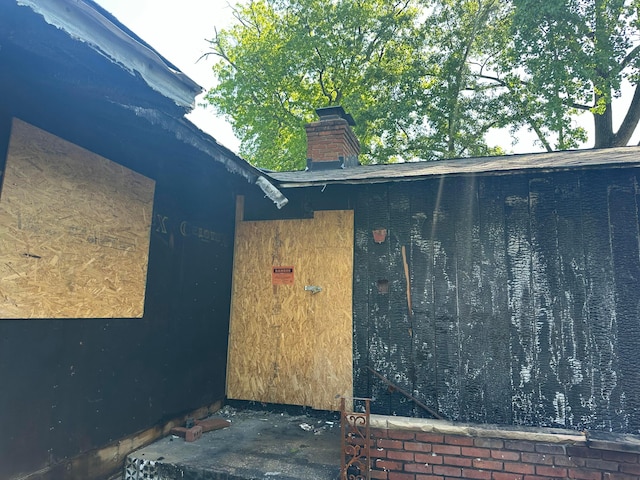 1294 Lancelot Rd, Columbus, OH 43227 - view of exterior entry featuring a chimney