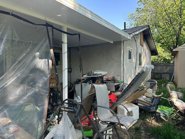 1294 Lancelot Rd, Columbus, OH 43227 - view of side of property with fence, central air condition unit, and stucco siding