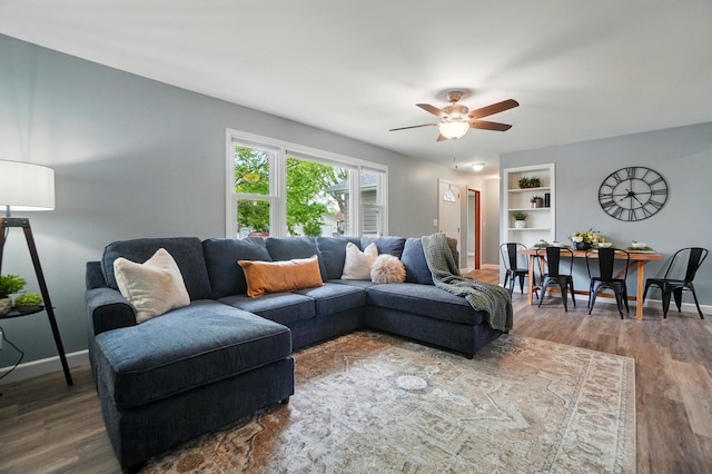 56 W Xenia St, Jamestown, OH 45335 - living area featuring ceiling fan, wood finished floors, and baseboards