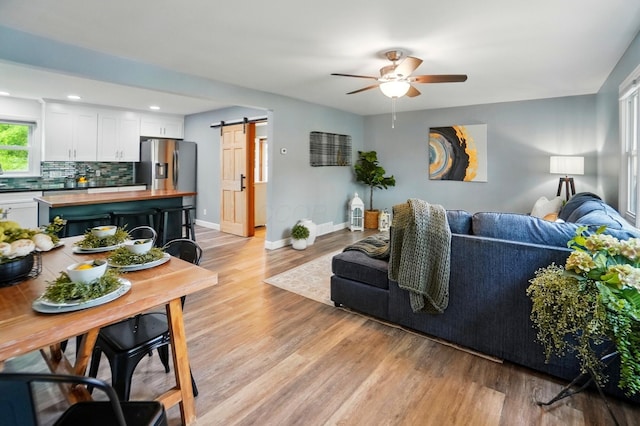 56 W Xenia St, Jamestown, OH 45335 - living area featuring a barn door, ceiling fan, light wood finished floors, baseboards, and recessed lighting