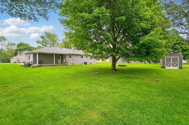 56 W Xenia St, Jamestown, OH 45335 - view of grassy yard featuring a shed and an outbuilding