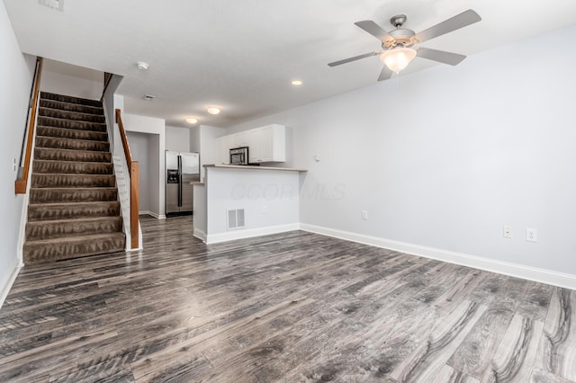 5962 Thunder Gulch Dr, New Albany, OH 43054 - unfurnished living room featuring dark wood-type flooring, stairway, baseboards, a ceiling fan, and recessed lighting