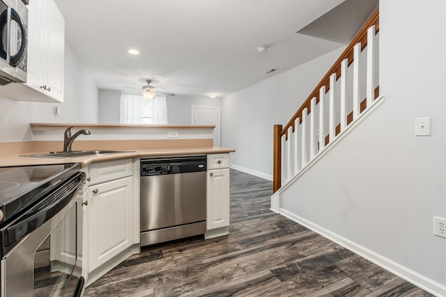 5962 Thunder Gulch Dr, New Albany, OH 43054 - kitchen with stainless steel appliances, a sink, ceiling fan, a peninsula, and white cabinetry