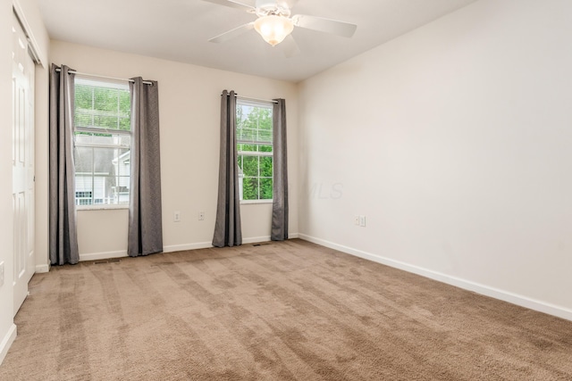 5962 Thunder Gulch Dr, New Albany, OH 43054 - empty room featuring carpet flooring, baseboards, healthy amount of natural light, and a ceiling fan