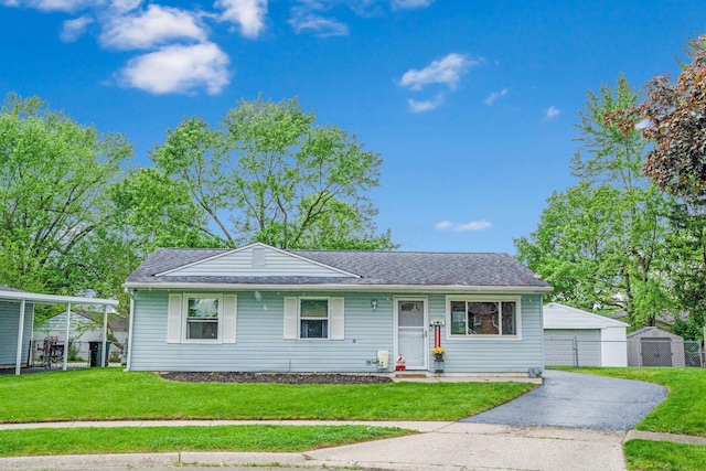 3233 Burdett Ct, Columbus, OH 43232 - view of front of property featuring a front yard, an outdoor structure, and a garage