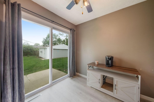 3233 Burdett Ct, Columbus, OH 43232 - entryway with baseboards, ceiling fan, and light wood finished floors