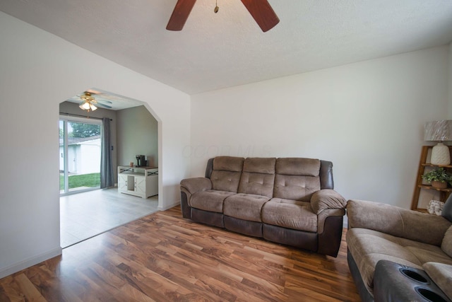 3233 Burdett Ct, Columbus, OH 43232 - living area featuring a ceiling fan, wood finished floors, and arched walkways