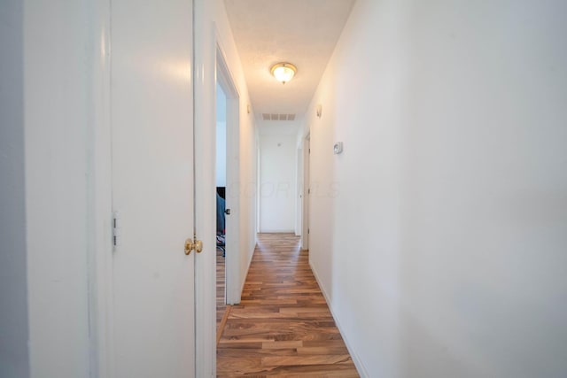 3233 Burdett Ct, Columbus, OH 43232 - corridor featuring light wood-type flooring and baseboards