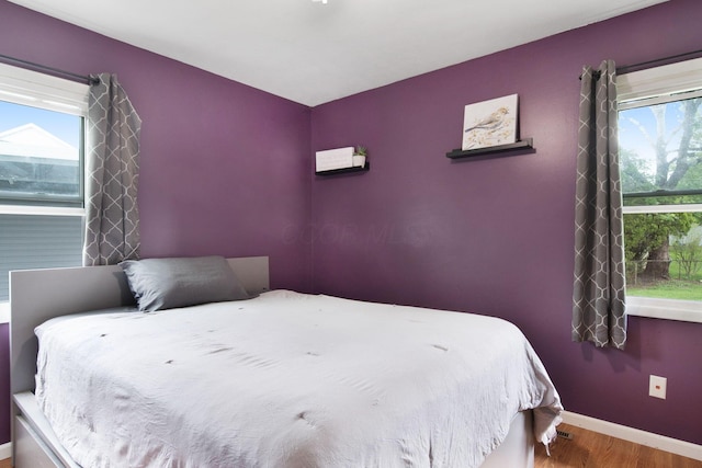 3233 Burdett Ct, Columbus, OH 43232 - bedroom with wood finished floors and baseboards