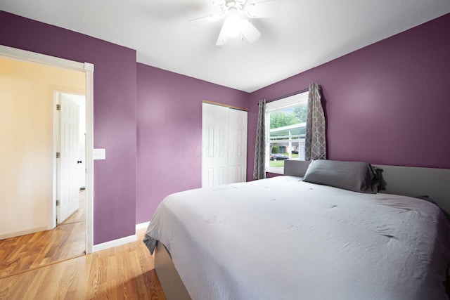 3233 Burdett Ct, Columbus, OH 43232 - bedroom featuring light wood-type flooring, baseboards, a closet, and ceiling fan