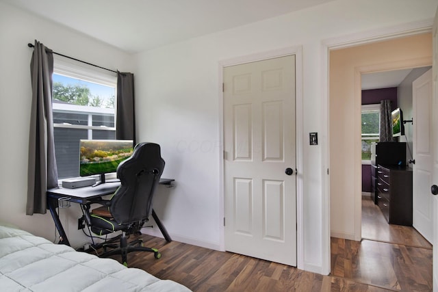 3233 Burdett Ct, Columbus, OH 43232 - bedroom with multiple windows, wood finished floors, an office area, and baseboards