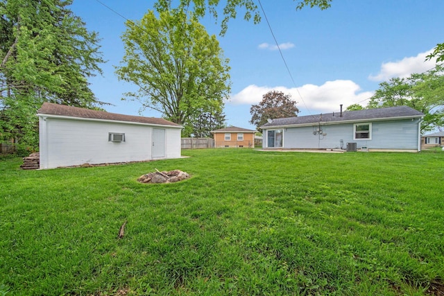 3233 Burdett Ct, Columbus, OH 43232 - view of yard featuring central AC unit and an outdoor structure