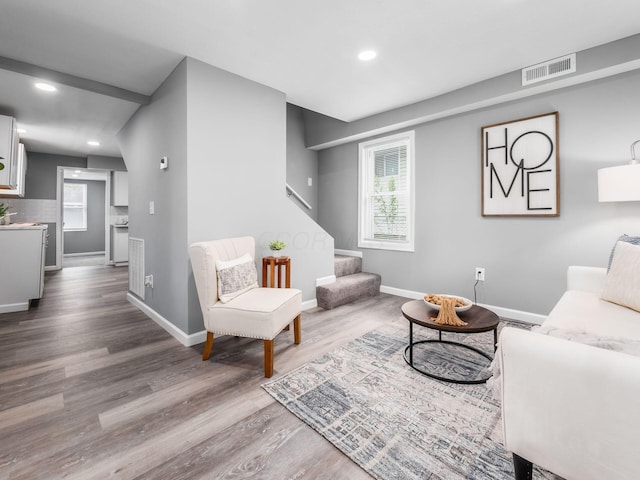 2767 Hiawatha St, Columbus, OH 43211 - living room featuring wood finished floors, stairway, recessed lighting, and baseboards