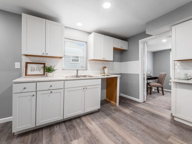 2767 Hiawatha St, Columbus, OH 43211 - kitchen featuring a sink, white cabinets, tasteful backsplash, baseboards, and recessed lighting