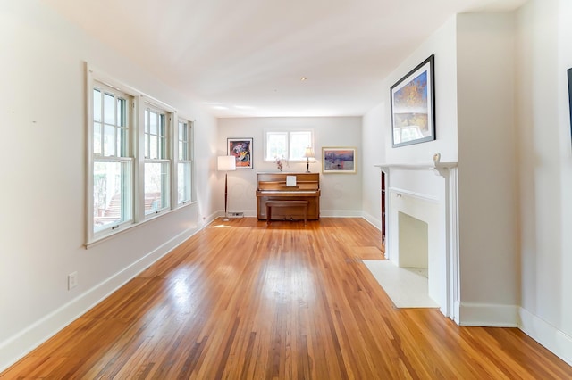 789 Chelsea Ave, Columbus, OH 43209 - living area with light wood-style flooring, baseboards, and a high end fireplace