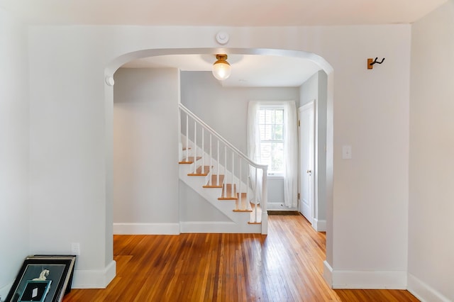 789 Chelsea Ave, Columbus, OH 43209 - foyer featuring arched walkways, hardwood / wood-style flooring, stairway, and baseboards