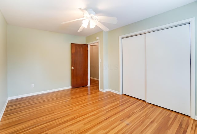 789 Chelsea Ave, Columbus, OH 43209 - unfurnished bedroom featuring light wood-style floors, a closet, a ceiling fan, and baseboards