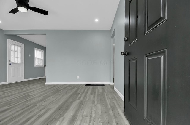 entrance foyer featuring light wood-type flooring, baseboards, a ceiling fan, and recessed lighting