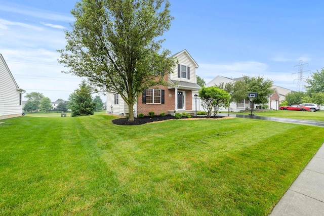 1608 Geranium Dr, Lewis Center, OH 43035 - view of front of house featuring brick siding and a front yard