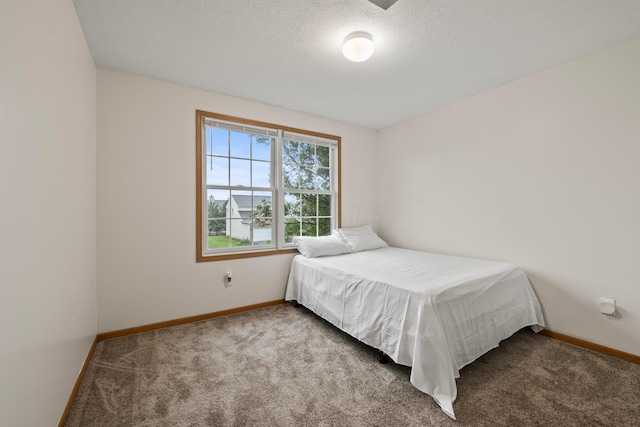 1608 Geranium Dr, Lewis Center, OH 43035 - bedroom featuring carpet, baseboards, and a textured ceiling