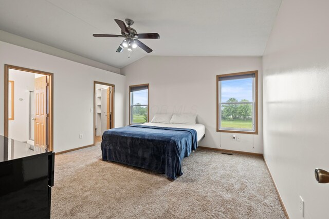 1608 Geranium Dr, Lewis Center, OH 43035 - carpeted bedroom with lofted ceiling, multiple windows, baseboards, and ceiling fan