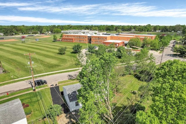 drone / aerial view of a tree filled landscape