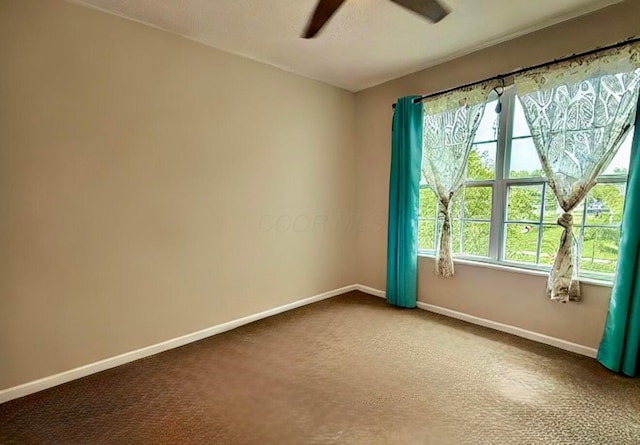 210 Glemsbury Dr, Delaware, OH 43015 - unfurnished room with ceiling fan, baseboards, and dark colored carpet