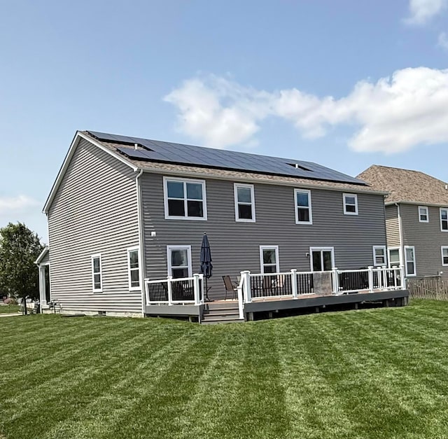 210 Glemsbury Dr, Delaware, OH 43015 - back of property featuring solar panels, a deck, and a yard