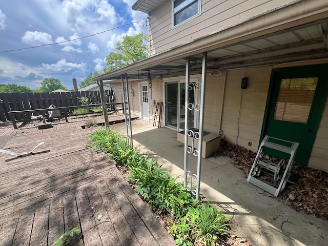view of patio / terrace with fence and a deck