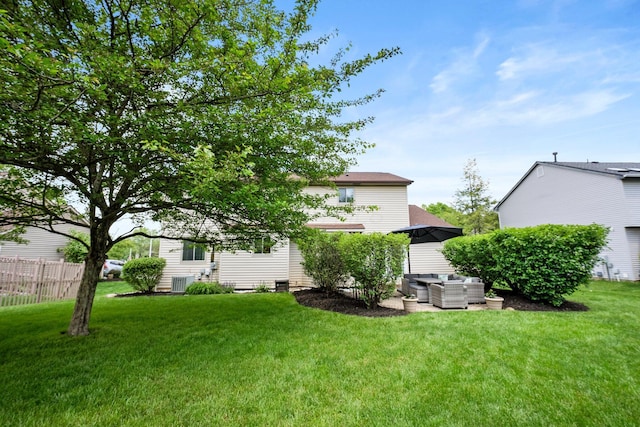 view of yard with outdoor lounge area and central air condition unit