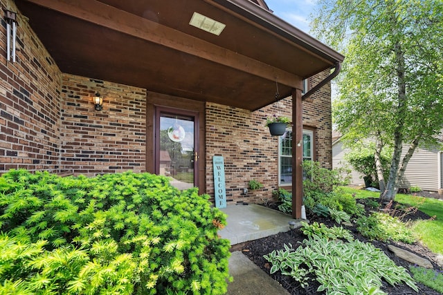 entrance to property with brick siding