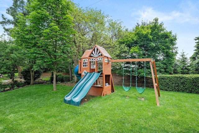 view of play area featuring a lawn and view of scattered trees