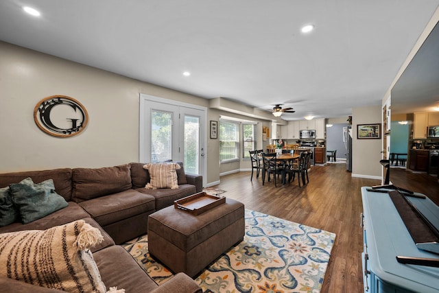 living area featuring baseboards, ceiling fan, dark wood-style flooring, and recessed lighting
