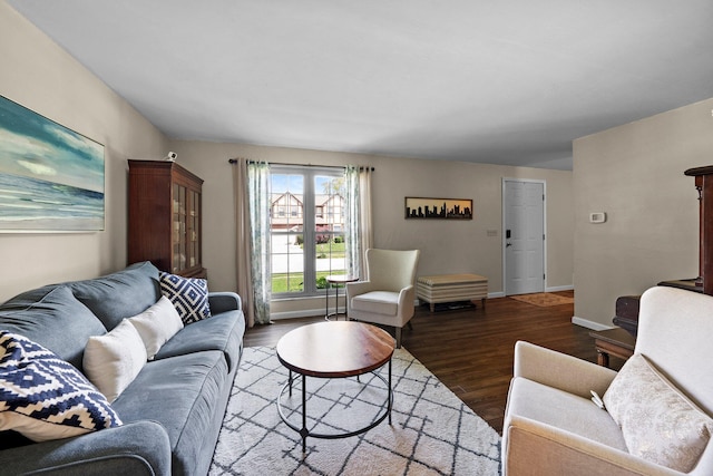 living area featuring wood finished floors and baseboards